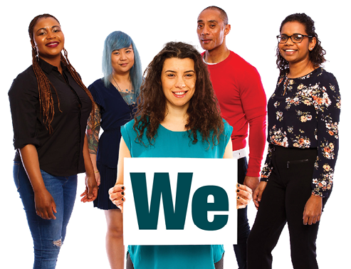 A group of people. There is a person at the front of the group holding a card that reads 'We'.