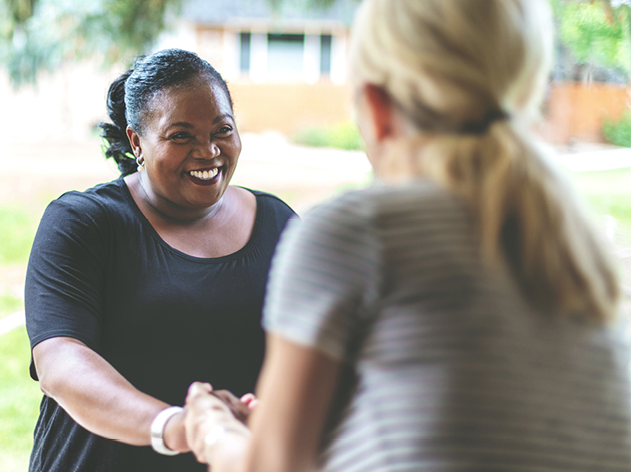 A person shaking hands with another person.