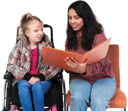 A person supporting someone with disability to read information from a folder.